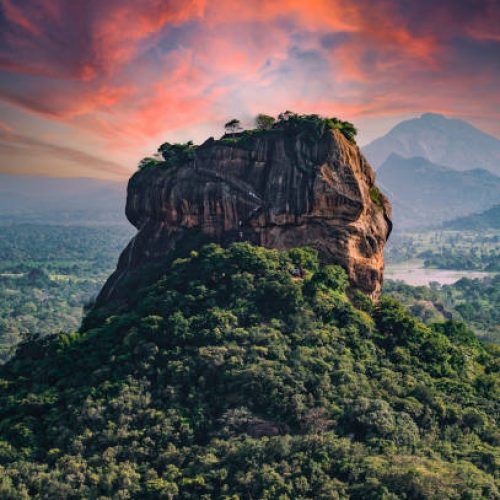 Spectacular view of the Lion rock surrounded by green rich vegetation. Picture taken from Pidurangala Rock in Sigiriya, Sri Lanka.